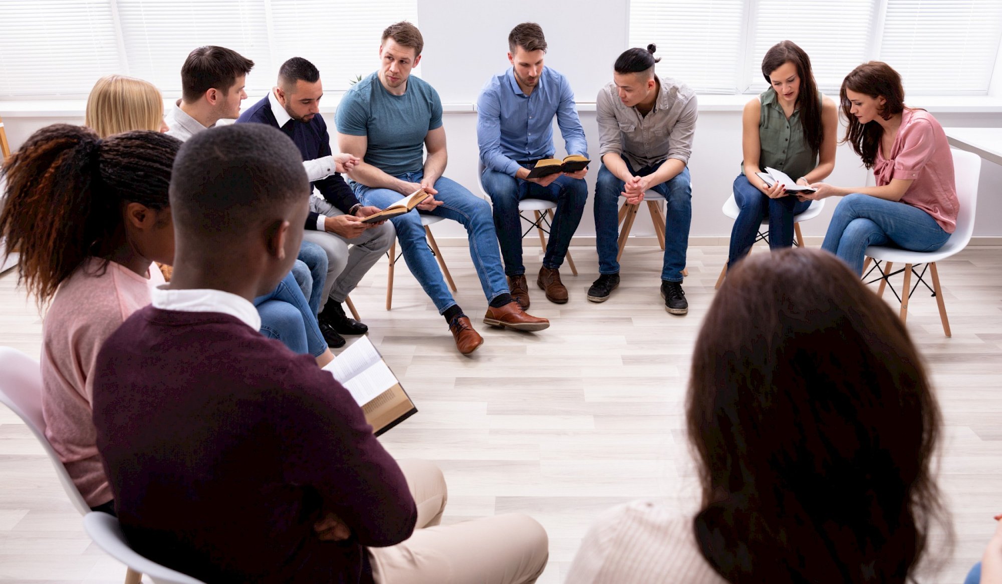 A group of young people reading together